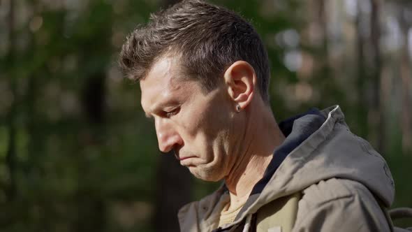 Side View Portrait of Curios Confident Caucasian Man Taking Photos of Nature with Camera in Forest alt