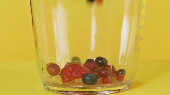 Preparation of Berry Morse. Fall of Berries in the Blender. Healthy Food, Vitamins. Close Up.