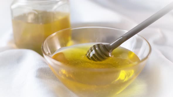 Thick Honey Dripping From the Honey Spoon alt