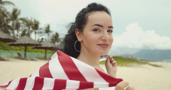 Patriotism Independence Day and Holidays Concept Happy Smiling Young Woman in Swimsuit with National alt
