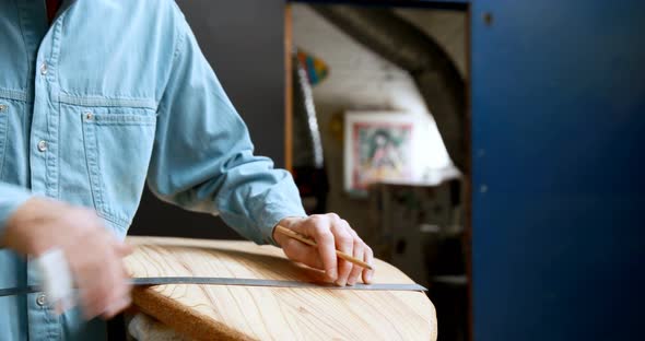 Man making surfboard 4k alt