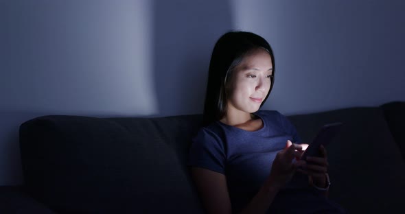 Woman Use of Smart Phone at Home in The Evening alt