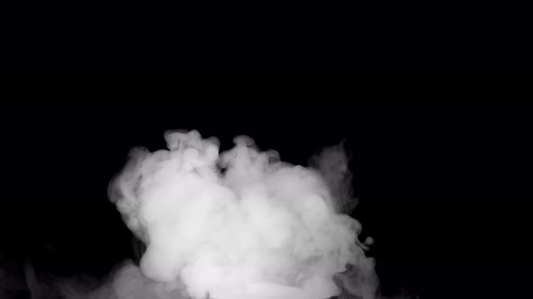 Soft fog in slow motion on dark background alt
