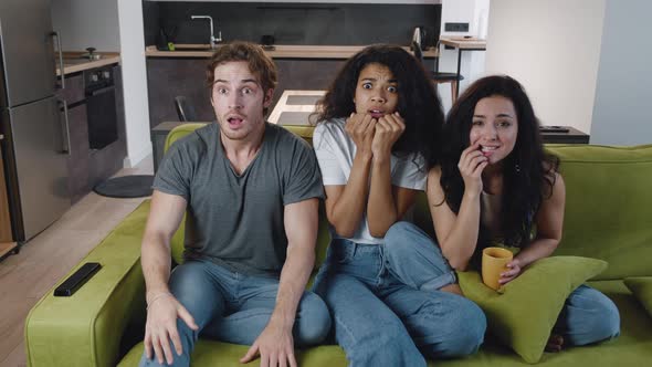 Fun Young Group of Multiethnic Friends Celebrate Win Goal Television Team Victory Together alt