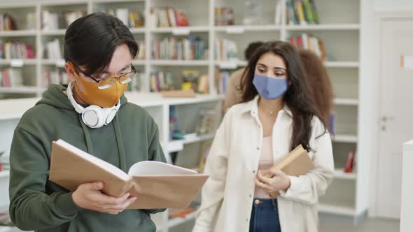 Couple of Diverse Students Reading Book alt