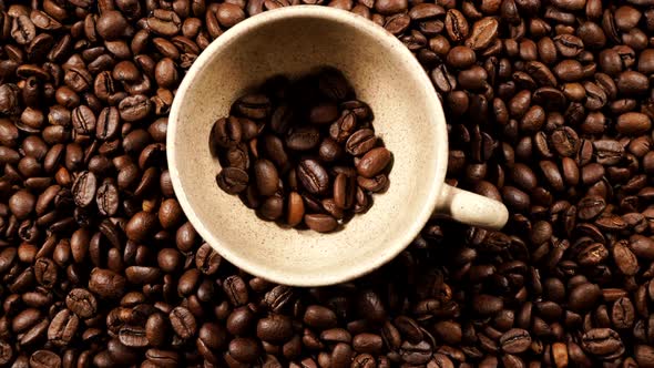 Coffee Cup with Roasted Coffee Beans. alt