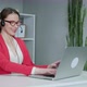 Woman Wears Headset Conference Calling on Laptop Talks with Online Teacher Studying from Home - VideoHive Item for Sale