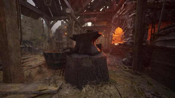 Blacksmiths Tools Hammer and Anvil in Old Blacksmiths Workshop alt