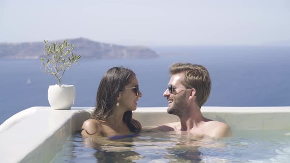 Couple Kissing and Relaxing in Pool
