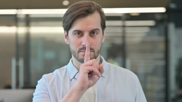 Mature Adult Man Showing Quiet Sign Finger on Lips alt