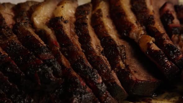 Rotating Shot of Delicious Smoked Brisket alt