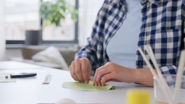 Woman Making Paper Craft at Home alt