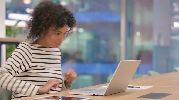 Young African Woman Standing Up and Going Away alt