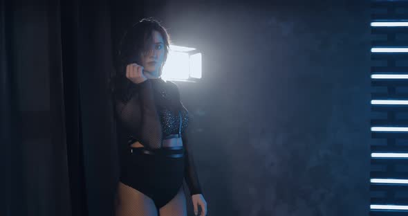 Beautiful Girl Dancing Seductively in a Sexy Costume alt