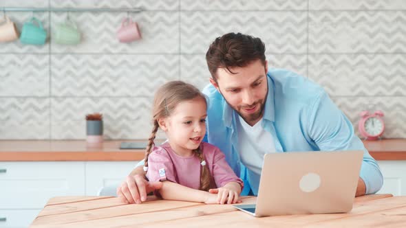 Young family with a child talking using a microphone and webcam alt