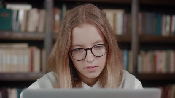 Little Schoolgirl Looking at Laptop Screen Reading Email with Unexpected Amazing News Celebrating alt
