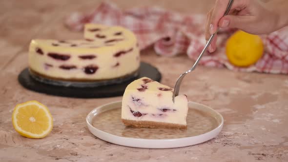 Piece of delicious cherry cheesecake.	