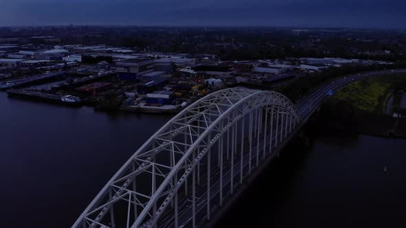 Steel Arch Bridge Over Noord River In South Holland, The Netherlands During Sunset. - Aerial Tilt Do alt