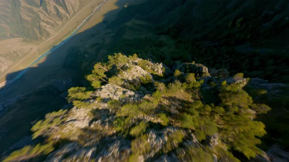 FPV Sports Drone Cliff Summit Rocky Stone Texture Plant at Sunset Valley Panorama Nature Landscape alt