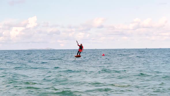 Athlete Showing Sport Trick Jumping with Kite and Board in Air. Extreme Water Sport and Summer alt