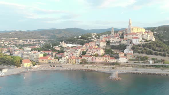 Aerial: flying around Cervo medieval town on the mediterranean coast, Liguria riviera, Italy alt