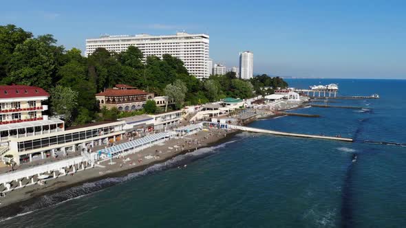 Aerial View of the City, Standing on the Coast, From the Sea. Sea View of the City Beach alt