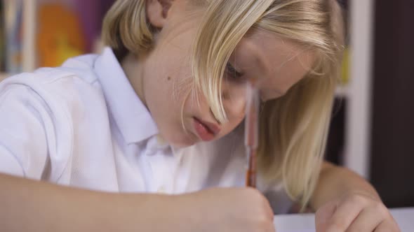 Distance Learning Online Education. A Small Teen Boy Study Online with Internet Teacher at Home.  alt