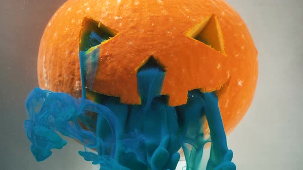 Scary Orange Pumpkin Decoration with Blue Paint From Mouth alt