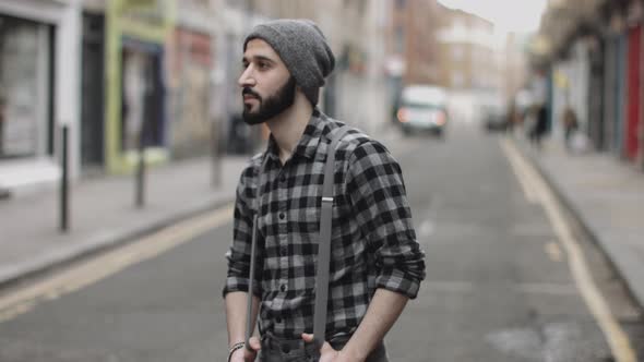 Portrait of Hipster male in street looking to camera, London, England