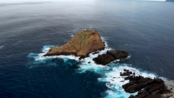 Drone Circle Around Ilheu Mole Cliff near Porto Moniz, Madeira Island, Portugal