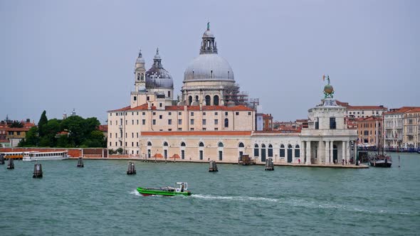 Boat Sailing At The Grand Canal In Venice, Italy. Basilica di Santa Maria della Salute At Punta dell alt