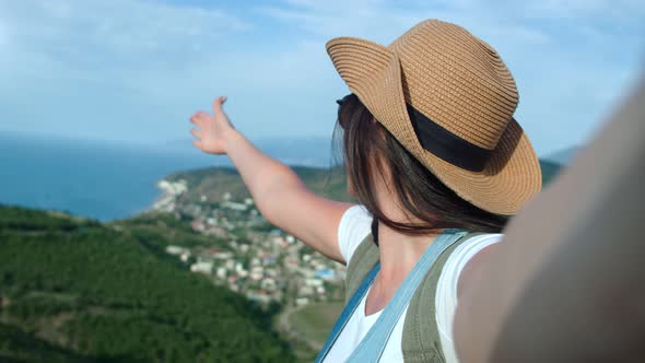 Closeup Smiling Travel Woman in Sunglasses and Hat Taking Selfie Showing Seascape Enjoying Vacation alt
