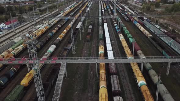 Freight Trains on the Railway Station. Wagons with Goods on Railroad alt