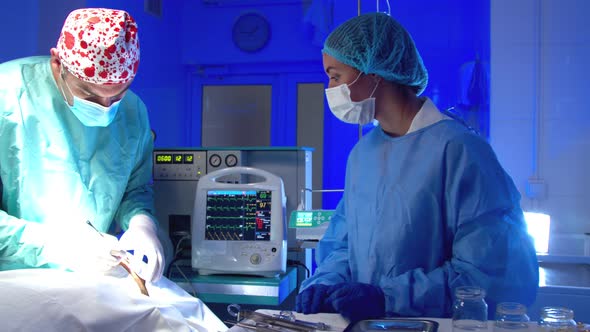 Surgeon Doing Surgery in Operating Room in Hospital