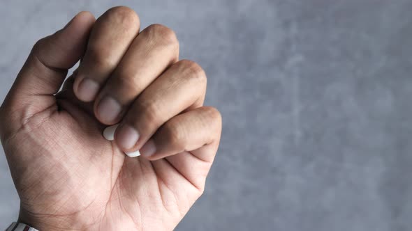 Top View of Capsule on Man Hand  alt