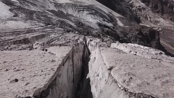 Flight Above Big Crack of Mizhirgi Glacier in Caucasus Mountains