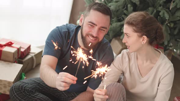 Couple Enjoying Bengal Lights Posing alt