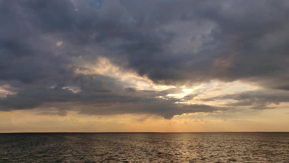 Sunset With Clouds Over The Sea. Dramatic Sunset Over The Sea. Romantic Sunset