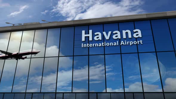 Airplane landing at Havana Cuba airport mirrored in terminal alt