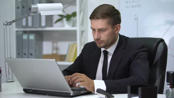 Businessman Working on Laptop Pc, Feeling Fever and Loosening Tie Up, Stress