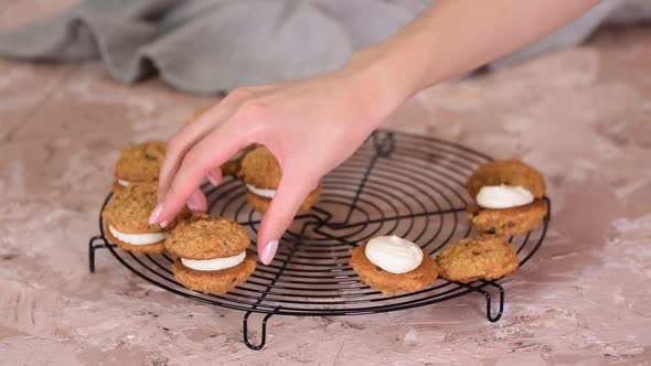 Carrot Cake Raising Cookie Sandwiches Stuffed with Cream Cheese