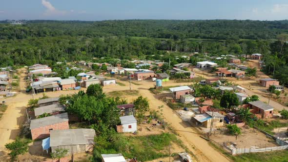 Indigenous slum outside the city of Manaus, Brazil. Aerial drone shot, push in. alt