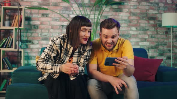 Very Good Looking Couple Excited Watching a alt