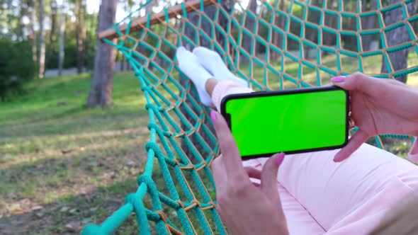 Smartphone in Hand with Chromakey Screen alt