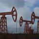 Oil worker standing among the oil pump jacks - VideoHive Item for Sale