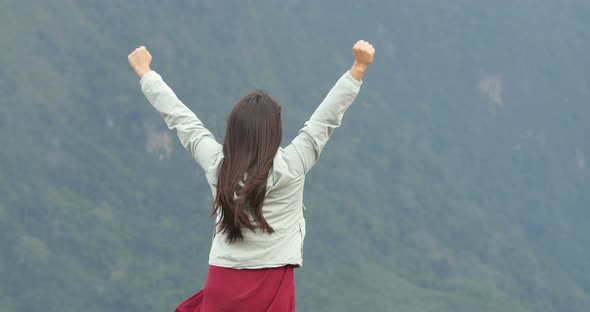 Woman Celebrating On The Top alt
