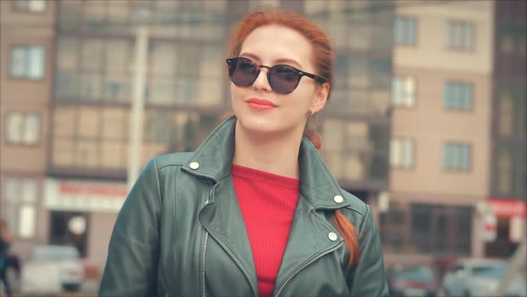 Portrait of an Attractive Smiling Young Woman with Glasses Close-up Face of a Happy Woman with Long alt