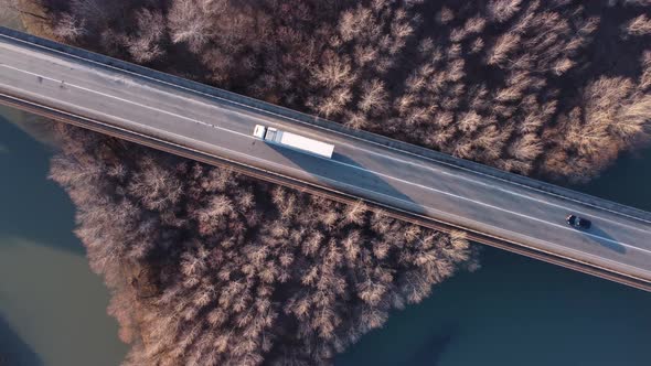 Cars On The Bridge Over The River And Forest alt