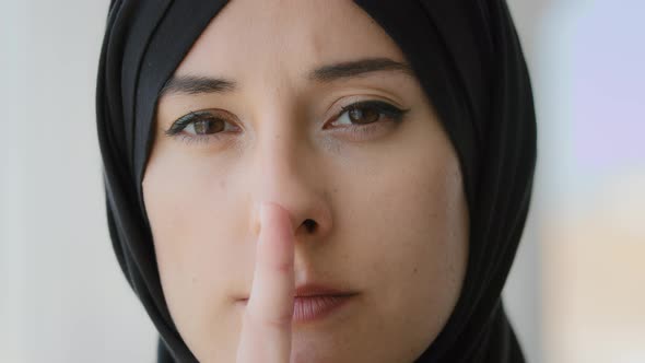 Female Portrait Girl in Hijab Showing Privacy Secrets Gesture alt