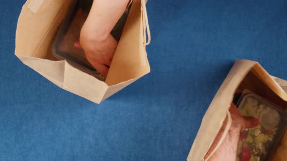 Taking Food Delivery in Disposable Containers From Paper Bags Top View Take Away Meals Catering alt